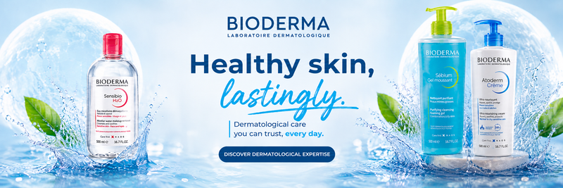 Bioderma skincare products with water droplets and leaves on a blue background