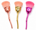 Delicate rose dusting brush designed for precise makeup application.