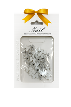 Elegant white nail bows add a delicate, feminine touch to your manicure.
