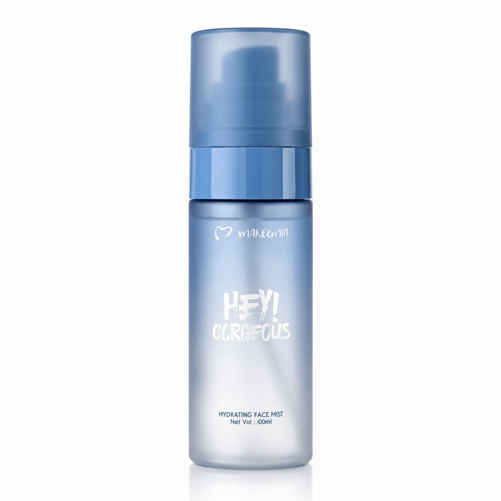 A 100ml bottle of milkzmii Hydrating Face Mist, featuring a frosted light blue body and a translucent medium blue cap, set against a plain white background.