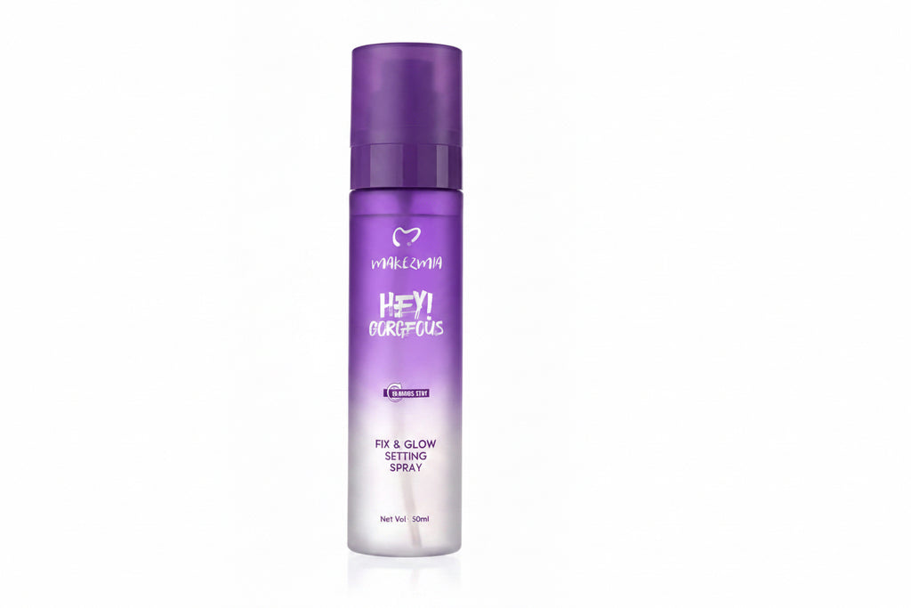 A purple and white spray bottle of Hey! Gorgeous Fix & Glow Setting Spray, shown on a clean white background.