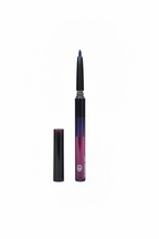 A hand holding a purple and black cosmetic pen with its cap removed, set against a cluttered background of other products on a shelf.
