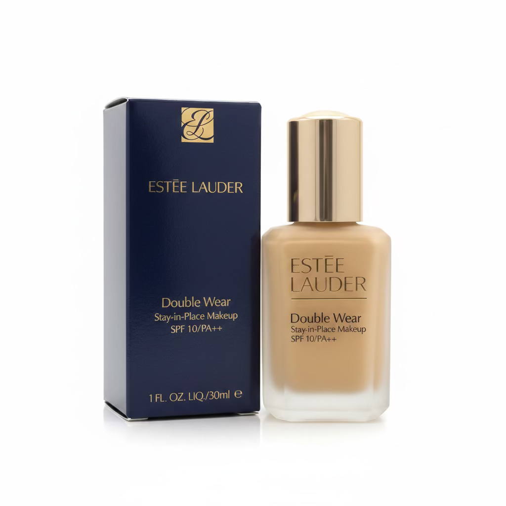 Estée Lauder Double Wear Stay-in-Place Makeup SPF 10/PA+++ in a frosted glass bottle with a metallic silver cap, shown next to its dark blue packaging box on a glass display counter.
