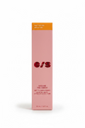 A pink rectangular box of O/S Secure the Sweat Mattifying Matifiant dry till dawn primer, displayed on a glass counter inside a retail store with shelves of other products in the background.