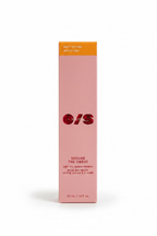 A pink rectangular box of O/S Secure the Sweat Mattifying Matifiant dry till dawn primer, displayed on a glass counter inside a retail store with shelves of other products in the background.