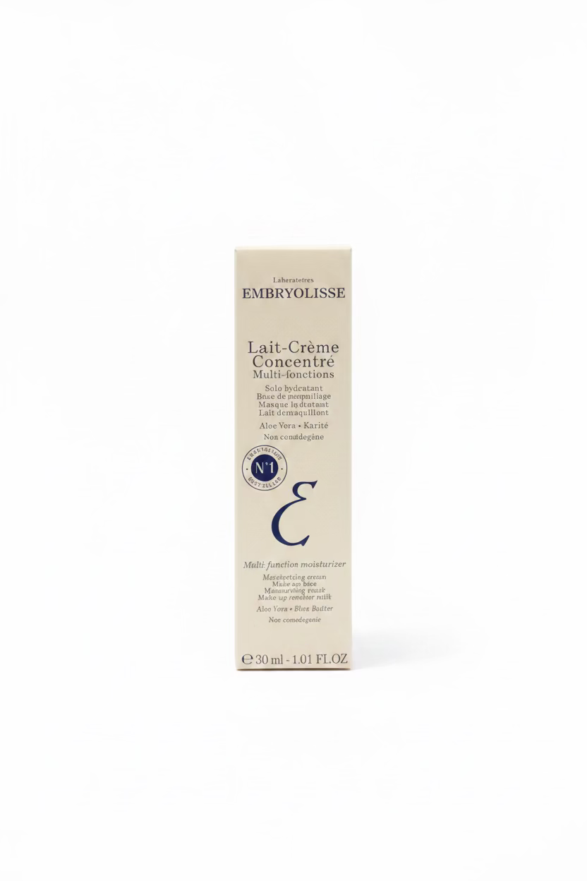 A box of EMBRYOLISSE Lait Crème Concentre Multi-fonctions skincare cream placed on a glass display counter inside a retail store.