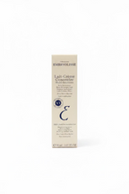 A box of EMBRYOLISSE Lait Crème Concentre Multi-fonctions skincare cream placed on a glass display counter inside a retail store.
