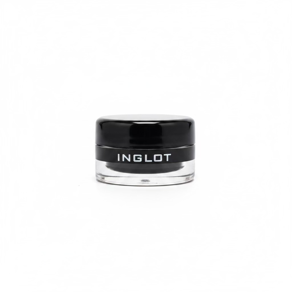 A hand holding a small clear cosmetic jar with a black lid. The lid has the brand name 'INGLOT' printed in white.