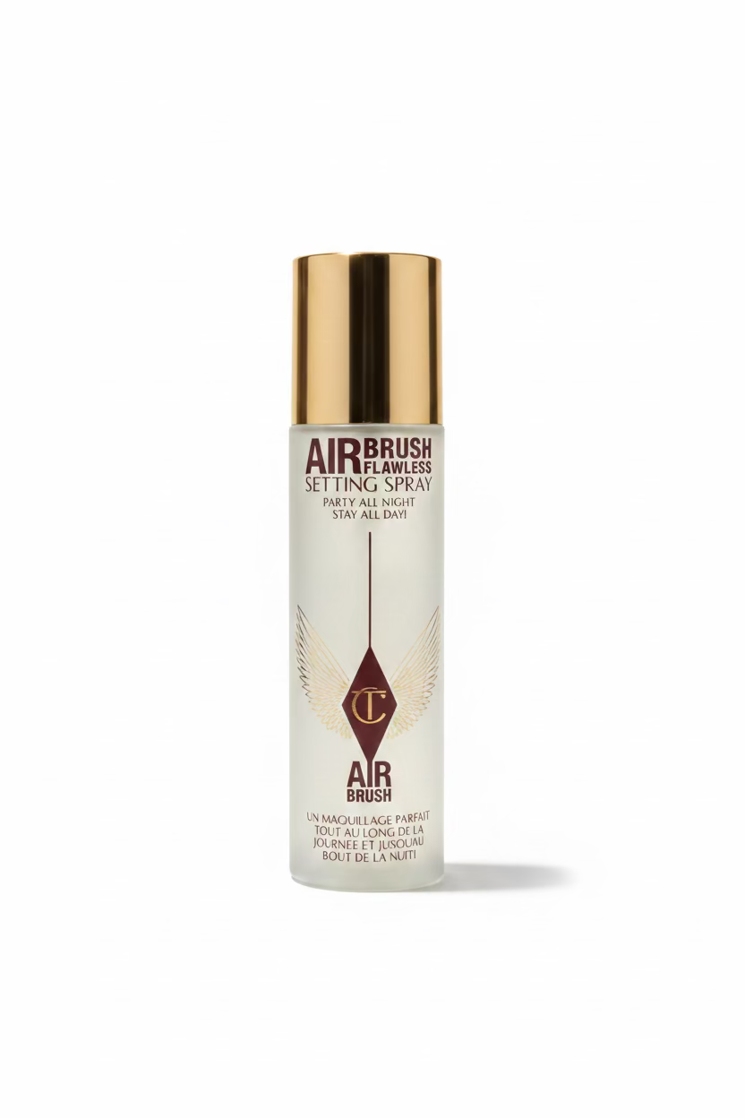 MediCube Air Brush Flawless Setting Spray bottle with a metallic gold cap, displayed on a glass shelf among other skincare packaging.