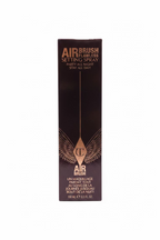 A tall black box of AIRBRUSH Airbrush Flawless Setting Spray standing on a glass display shelf, surrounded by other cosmetic boxes in a store.