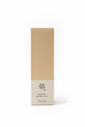 A tall rectangular box of Beauty of Joseon Ginseng Essence Water standing on a glass display shelf, with other cosmetic boxes blurred in the background.