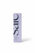 A tall rectangular box of SCF Glowy Super Gel moisturizer standing on a glass counter in a retail store. The box is light lavender with large black SCF lettering and product text near the bottom.