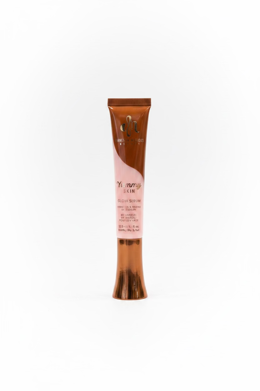 A tube of Yummy Skin Glow & Brighten gel in a brown and pink packaging, standing on a glass display counter inside a retail store.