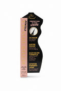 A hand holding a tube of Too Faced Better Than Sex Eyeliner against a busy desk background with a laptop and other items.