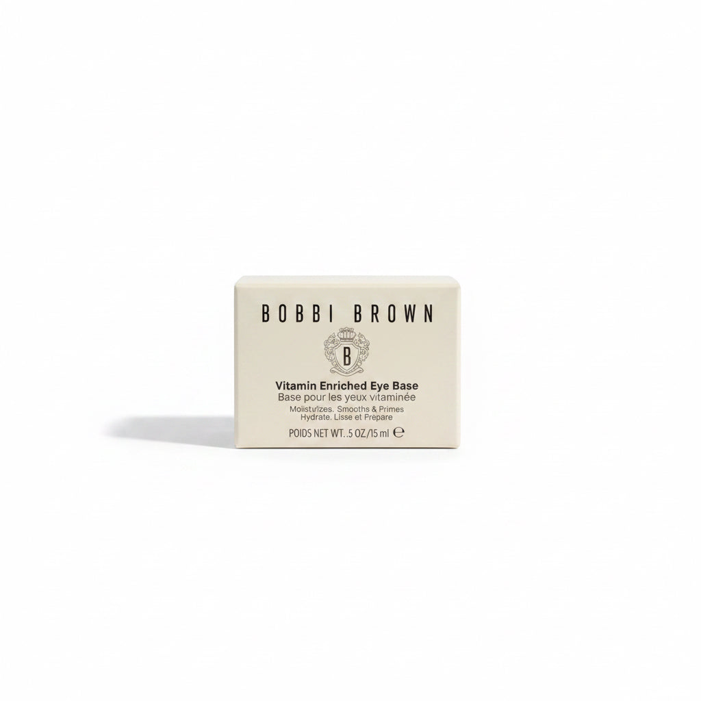 A box of Bobbi Brown Vitamin Enriched Eye Base placed on a glass display counter next to a red Argan Score 20 Developer bottle.