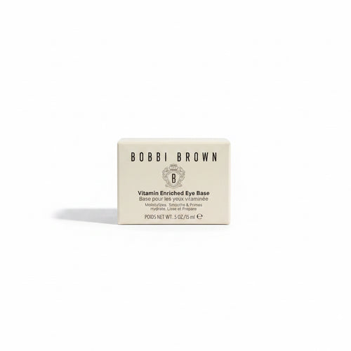 A box of Bobbi Brown Vitamin Enriched Eye Base placed on a glass display counter next to a red Argan Score 20 Developer bottle.