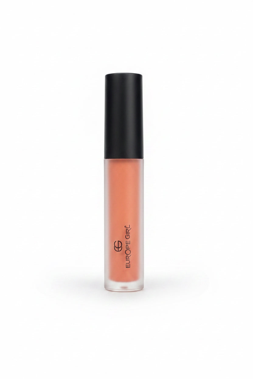 A hand holding a frosted tube of liquid lipstick in a peachy nude shade with a black cap. The brand name 'HOCHLAU' is printed vertically on the tube.
