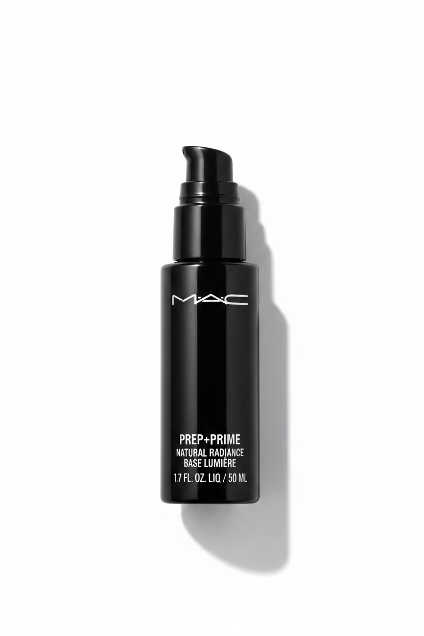 A black MAC Prep + Prime foundation bottle standing on a glass display counter in a retail setting, with a laptop and store fixtures visible in the background.