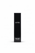 A black rectangular box of MAC Prep+Prime Natural Radiance Base Luminére, standing on a glass display counter inside a retail store.