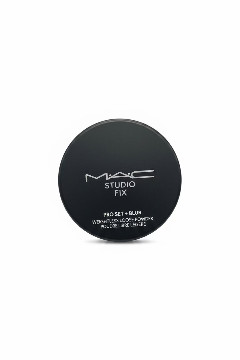 A hand holding a black round compact of MAC Studio Fix Pro Set + Blur Loose Powder, with the MAC logo and product name clearly visible on the lid.
