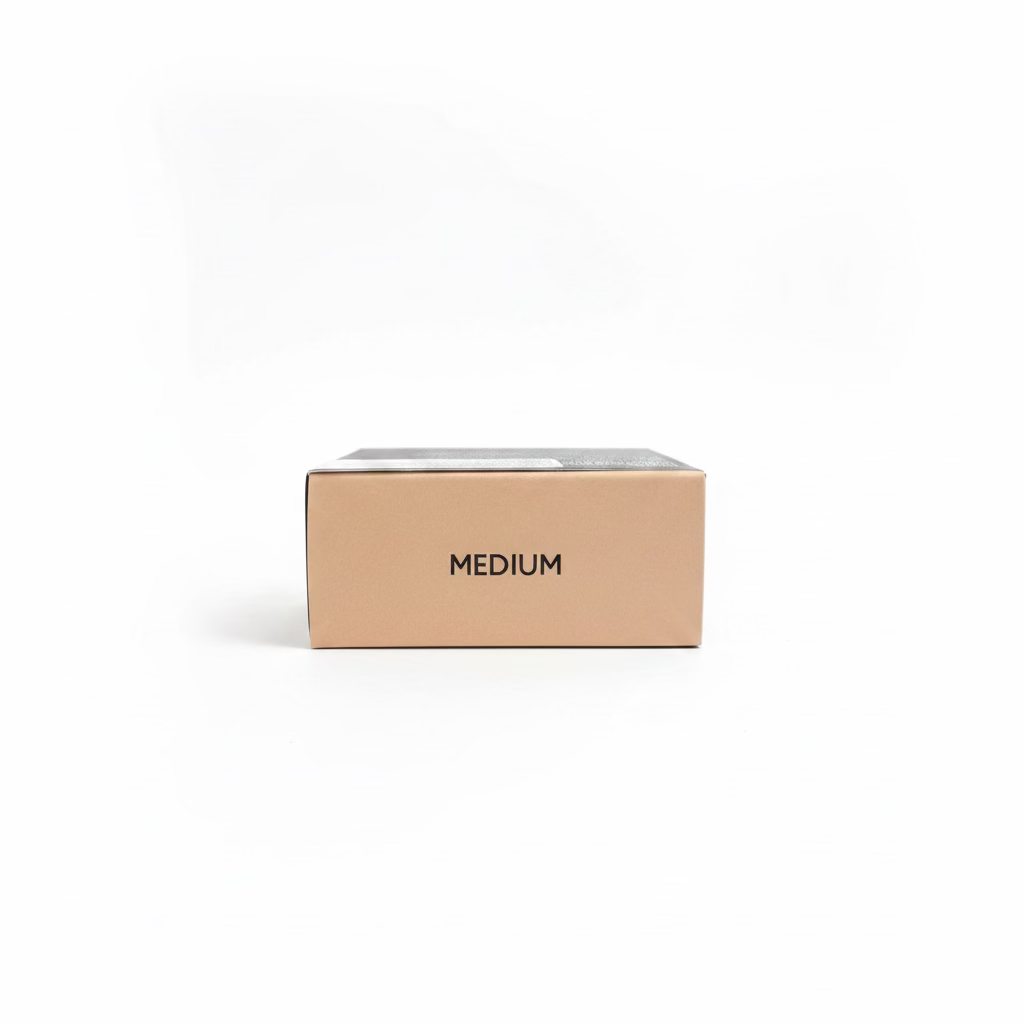 A beige cardboard box labeled 'MEDIUM' sits on a glass shelf in a retail setting, with a gold Mynk package below and a laptop and shelves in the background.