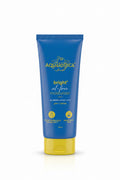 A tube of Aqualógica bright oil-free moisturizer, blue with a yellow cap, displayed on a glass counter inside a retail store.
