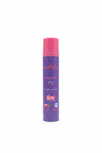 A bottle of Aqualogic Illuminate Dewy Sunscreen Gel SPF 50+ with a purple body and pink cap, standing on a glass display counter in a retail store.