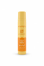 A can of Aqualogica Glow Dewy Gel Sunscreen SPF 50+ standing on a red surface next to an open laptop, with shelves of skincare products in the background.