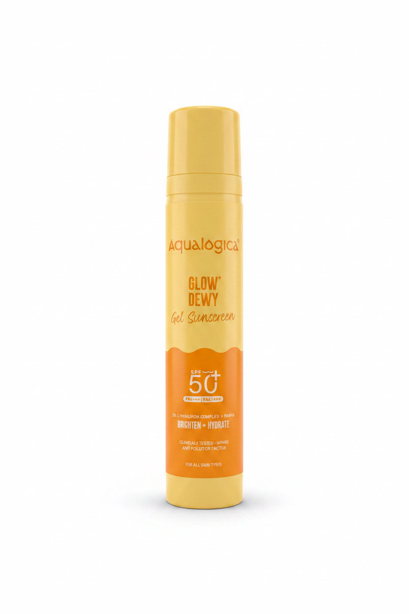 A can of Aqualogica Glow Dewy Gel Sunscreen SPF 50+ standing on a red surface next to an open laptop, with shelves of skincare products in the background.