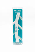 A packaged Glam Nail Buffer labeled Banana Buffer, standing in front of two laptop screens. The product is in its original teal and white blister packaging, with the white nail file visible inside.