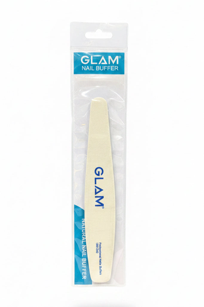 A hand holding a packaged Glam Nail Buffer against a dark wood background and blue jeans.