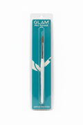A packaged Glam Pro Range acrylic brush #12 standing upright in front of an open laptop on a desk. The brush is in clear plastic packaging with a teal card backing and a white handle visible through the package.