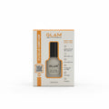 GLAM Cuticle Remover in its original white and orange retail box, placed on top of a silver laptop on a desk with a computer monitor and office items in the background.