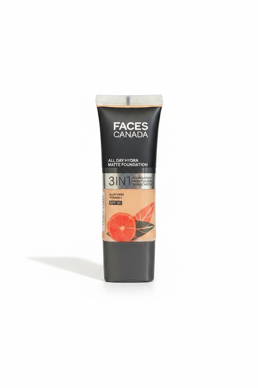 A hand holding a tube of Faces Canada 3-in-1 All Day Hydra Matte Foundation SPF 30, set against a background of blue denim jeans.
