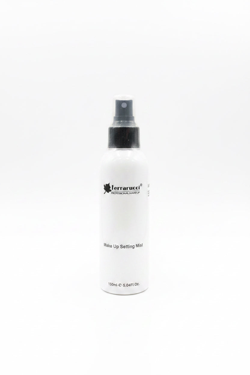 A bottle of Terrarucel Professional Makeup Setting Mist placed on a glass tabletop, surrounded by other cosmetic products, a laptop, and storage baskets in a retail or office setting.