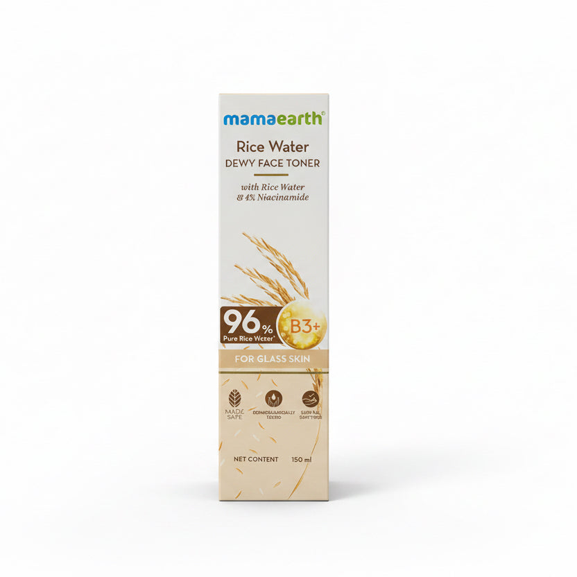 A box of Mama Earth Rice Water Dewy Face Toner stands on a countertop in a store or home setting, with a green basket, a yellow bottle, and other products in the background.