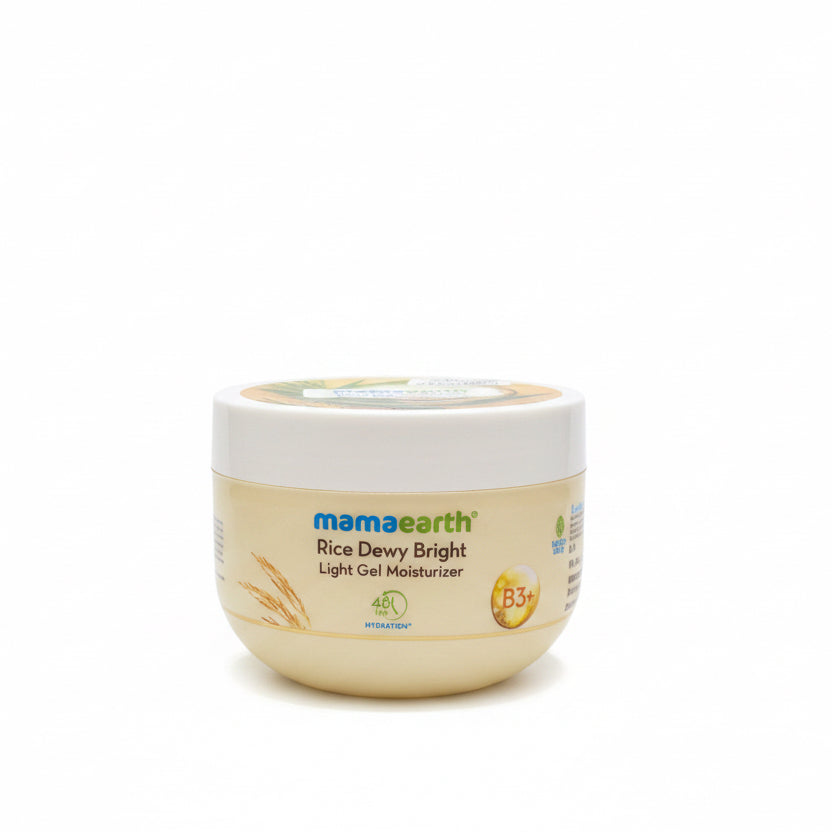 A jar of Mamaearth Rice Dewy Bright Light Gel Moisturizer placed on a dark countertop in front of a mint green plastic storage basket.