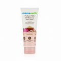 A tube of Mama Earth Multani Mitti Oil Balance Face Wash is displayed on a black countertop. The background features a green plastic basket, a laptop on a red wallet, and a store interior with shelves.
