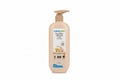 A bottle of Mama Earth Rice Water Hydrating Face Lotion standing on a wooden surface in an indoor setting with textured wall panels and dark furniture in the background.
