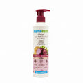 A bottle of Mama Earth Onion Hair Fall Control Shampoo standing on a table in front of an open laptop computer.