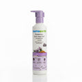 A bottle of Mama Earth Rosemary Anti-Hair Fall Shampoo standing on a laptop in a home office setting.