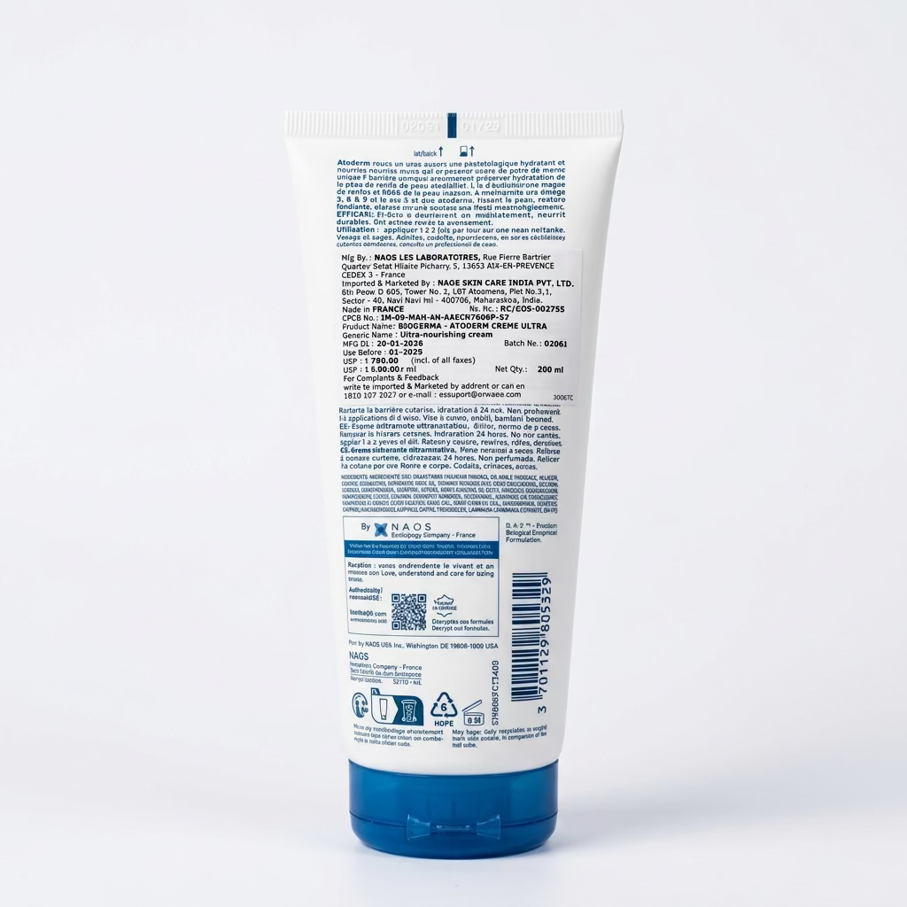 A white tube of Kao Kao makeup cream with a blue cap, showing the detailed product instructions and ingredients on the back, placed on a desk with a keyboard and papers in the background.