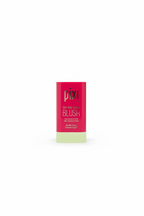 Pixi De-itch-Glow Blush stick in a red and pale yellow tube, displayed on a glass shelf with other cosmetic products in a store setting.