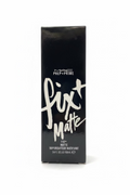 A black rectangular box of MAC Prep+Prime Fix + Matte liquid lipstick stands on a glass display shelf in a retail store. The box features white text and is surrounded by shelves of cosmetics and a laptop in the background.